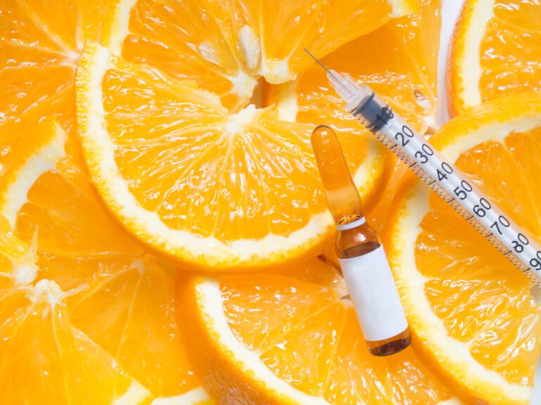 High dose vitamin C brown ampule for injection with syringe on f